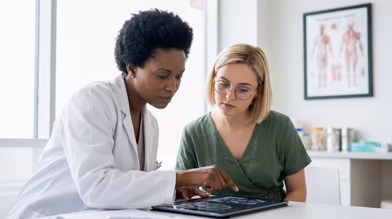 Doctor and patient consultation for Further Details on the Cambridge Ear Wax Removal Service - Best Way To Make Your Way To...