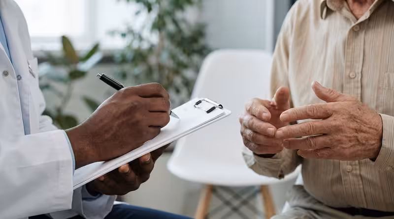 Public Transport and Other Ways to Travel: A doctor and patient during a consultation Doctor and patient consultation for Public Transport and Other Ways to Travel - Travel Time To Hearing First Oxford