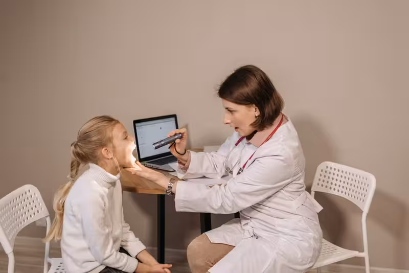 Book Your Microsuction Ear Wax Removal Appointment Today, And Say Goodbye to the Discomfort of Ear Wax.: A doctor in a clinic Doctor in clinic for Book Your Microsuction Ear Wax Removal Appointment Today, And Say Goodbye to the Discomfort of Ear Wax...